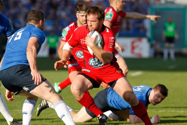 Leinster's Irish Full Back Rob Kearney, left,  tries to stop Toulon's hooker Craig Burden  of South Africa , center, who  runs past Leinster's Irish Centre Brian O'Driscol, bottom,  during their Heineken European Cup quarter final rugby match, at the Mayol stadium, in Toulon, southern France, Sunday, April 6, 2014. (AP Photo/Claude Paris)