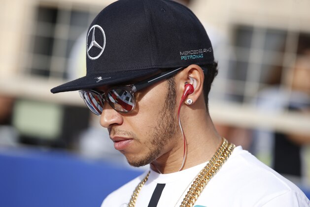 Mercedes driver Lewis Hamilton of Britain attends the drivers parade prior to the start of the Bahrain Formula One Grand Prix at the Formula One Bahrain International Circuit in Sakhir, Bahrain, Sunday, April 19, 2015. (AP Photo/Luca Bruno)