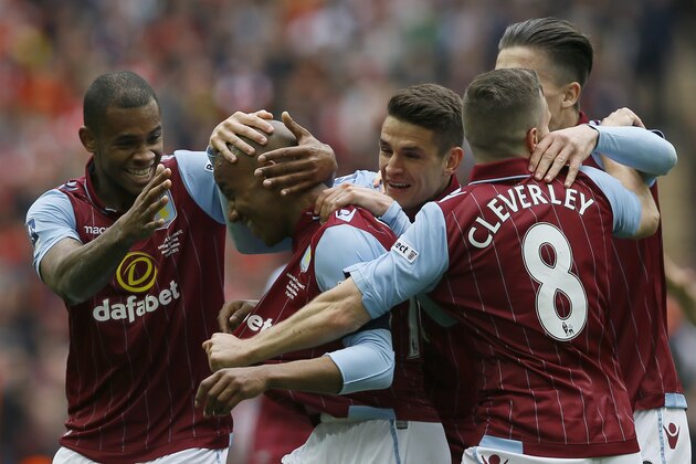 Aston Villa’s Fabian Delph, second left, celebrates with teammates, after scoring his sides second goal of the game during the English FA Cup  semifinal soccer match between Liverpool and  Aston Villa at Wembley Stadium in London, Sunday, April 19, 2015. (AP Photo/Kirsty Wigglesworth)
