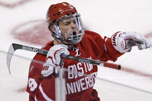 Boston University forward Jack Eichel celebrates after his goal against North Dakota during the first period of a semifinal at the NCAA men's Frozen Four hockey tournament in Boston, Thursday, April 9, 2015. (AP Photo/Charles Krupa)