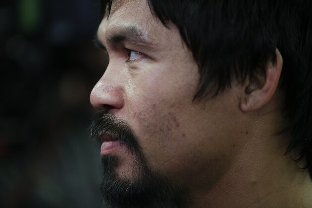 Boxer Manny Pacquiao, of the Philippines, talks to reporters during a media workout at Wild Card Boxing Club, Wednesday, April 15, 2015, in Los Angeles. Pacquiao is scheduled to fight Floyd Mayweather Jr. in a welterweight boxing match in Las Vegas on May 2. (AP Photo/Jae C. Hong)