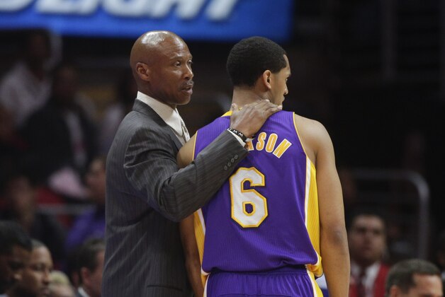 Los Angeles Lakers head coach Byron Scott, left, talks to Jordan Clarkson during the second half of an NBA basketball game against the Los Angeles Clippers, Tuesday, April 7, 2015, in Los Angeles. The Clippers won 105-100. (AP Photo/Jae C. Hong)