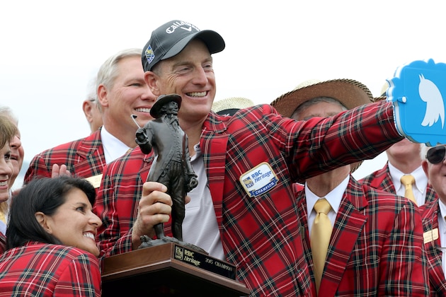 Jim Furyk, center and South Carolina Governor Nikki Haley, lower left, pose for a photo after Furyk won a playoff against Kevin Kisner during the RBC Heritage golf tournament in Hilton Head Island, S.C., Sunday, April 19, 2015. (AP Photo/Stephen B. Morton)