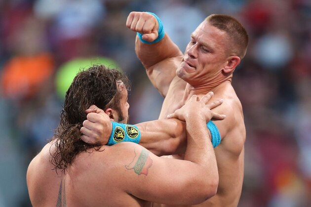 WWE wrestler John Cena punches Rusev at Wrestlemania XXXI, on Sunday, March 29, 2015 in Santa Clara, CA. 2015 marks the first year Wrestlemania will be held in the San Francisco Bay Area, being made available to viewers in 177 countries via the WWE Network. (Don Feria/AP Images for WWE)