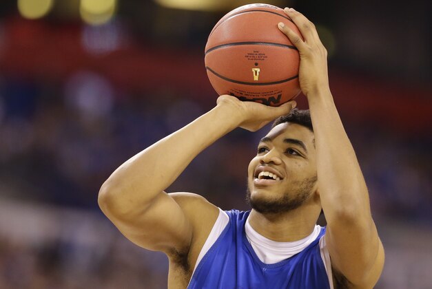 Kentucky's Karl-Anthony Towns shoots during a practice session for the NCAA Final Four tournament college basketball semifinal game Friday, April 3, 2015, in Indianapolis. Kentucky plays Wisconsin on Saturday. (AP Photo/Michael Conroy)