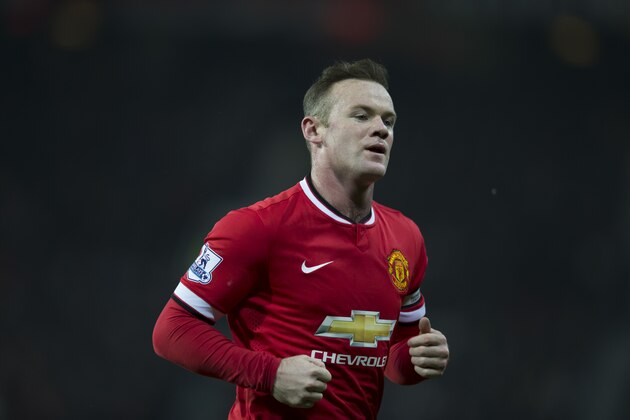 Manchester United's Wayne Rooney runs to take a corner during the English Premier League soccer match between Manchester United and Burnley at Old Trafford Stadium, Manchester, England, Wednesday Feb. 11, 2015. (AP Photo/Jon Super)