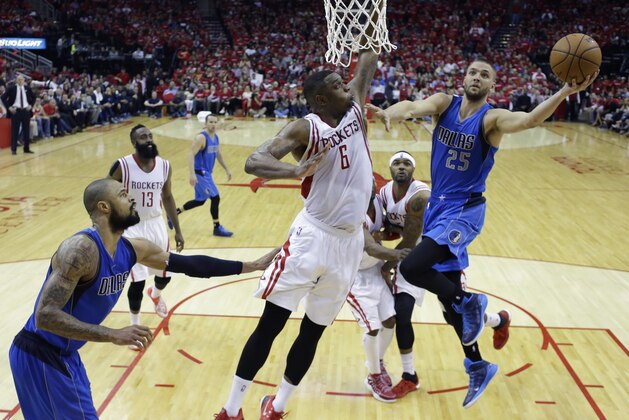 Dallas Mavericks' Chandler Parsons (25) drives to the basket over Houston Rockets' Terrence Jones (6) during the second half of game 1 in the first round of the NBA basketball playoffs Saturday, April 18, 2015, in Houston. Houston won 118-108. (AP Photo/David J. Phillip)