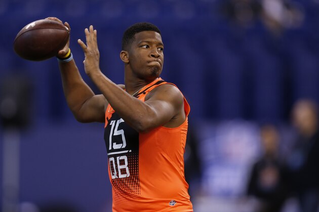 Florida State quarterback Jameis Winston runs a drill at the NFL football scouting combine in Indianapolis, Saturday, Feb. 21, 2015. (AP Photo/Julio Cortez)