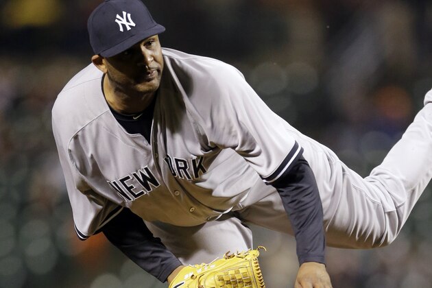 New York Yankees starting pitcher CC Sabathia follows through on a pitch to the Baltimore Orioles in a baseball game, Tuesday, April 14, 2015, in Baltimore. (AP Photo/Patrick Semansky)