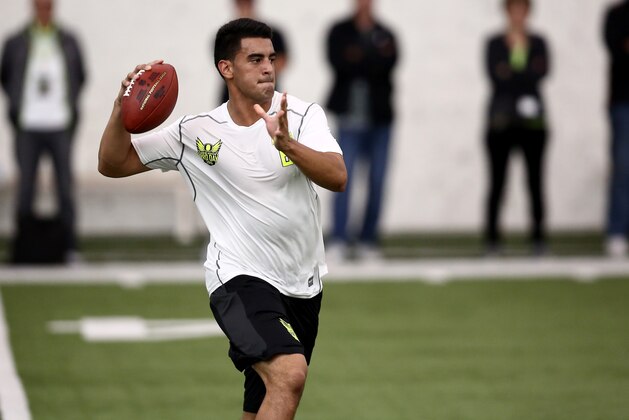 Oregon's Marcus Mariota works out for NFL football scouts during Pro Day at the University of Oregon, Thursday, March 12, 2015, in Eugene, Ore. (AP Photo/Ryan Kang)