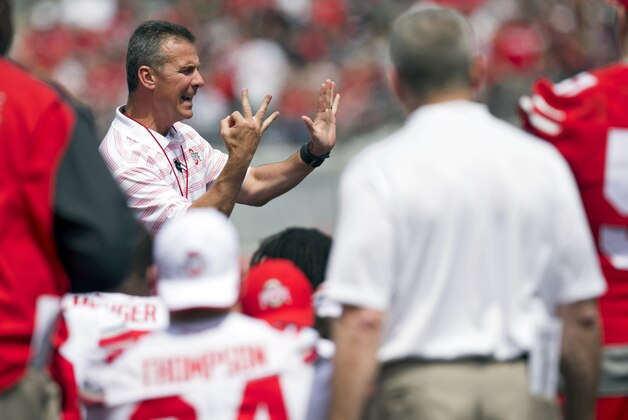 Apr 18, 2015; Columbus, OH, USA; Ohio State Buckeyes head coach Urban Meyer talks to his team before the Ohio Spring Game at Ohio Stadium. Mandatory Credit: Greg Bartram-USA TODAY Sports