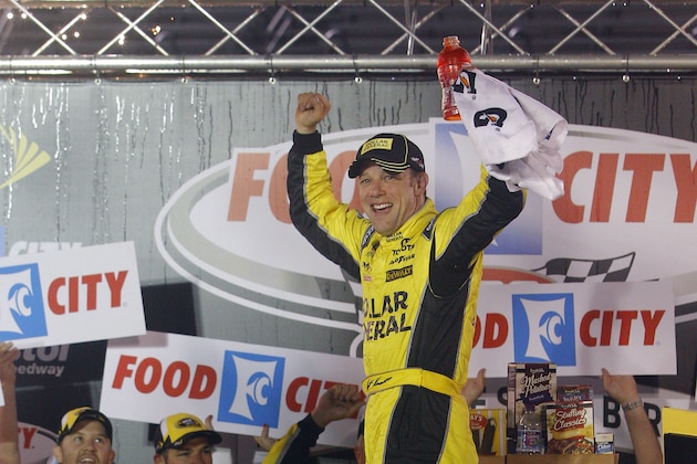 Driver Matt Kenseth celebrates in victory lane after winning  a NASCAR Sprint Cup Series auto race at Bristol Motor Speedway on Sunday, April 19, 2015, in Bristol, Tenn. (AP Photo/Wade Payne)