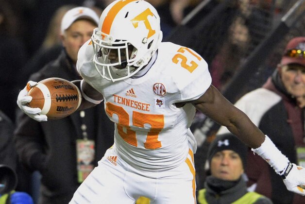 Tennessee's Justin Coleman returns an interception whlie pressured by South Carolina's Brandon Wilds during the first half of an NCAA college football game in Columbia, S.C.,  Saturday, Nov. 1, 2014. Tennessee won 45-42. (AP Photo/Richard Shiro)