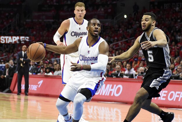 Apr 19, 2015; Los Angeles, CA, USA; Los Angeles Clippers guard Chris Paul (3) drives to the basket against San Antonio Spurs guard Cory Joseph (5) during the first quarter in game one of the first round of the NBA Playoffs at Staples Center. Mandatory Credit: Richard Mackson-USA TODAY Sports