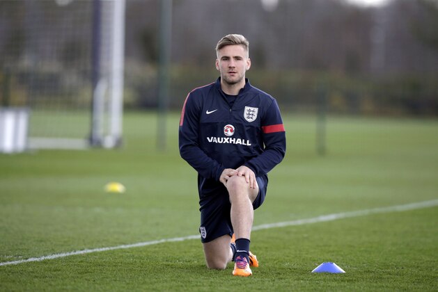 England's Luke Shaw takes part in a national soccer squad training session at the training facilities of Tottenham Hotspur football club in Enfield, England, Monday, March 3, 2014. England play Denmark in an international friendly soccer match at Wembley stadium in London on Wednesday. (AP Photo/Matt Dunham)