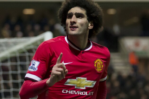 Manchester United's Marouane Fellaini celebrates after scoring during the English FA Cup Fifth Round soccer match between Preston and Manchester United at Deepdale Stadium in Preston, England, Monday Feb. 16, 2015.  (AP Photo/Jon Super)