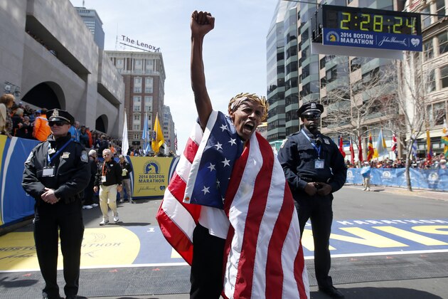 Meb Keflezighi, of San Diego, Calif., celebrates his victory in the 118th Boston Marathon, Monday, April 21, 2014, in Boston. (AP Photo/Elise Amendola)