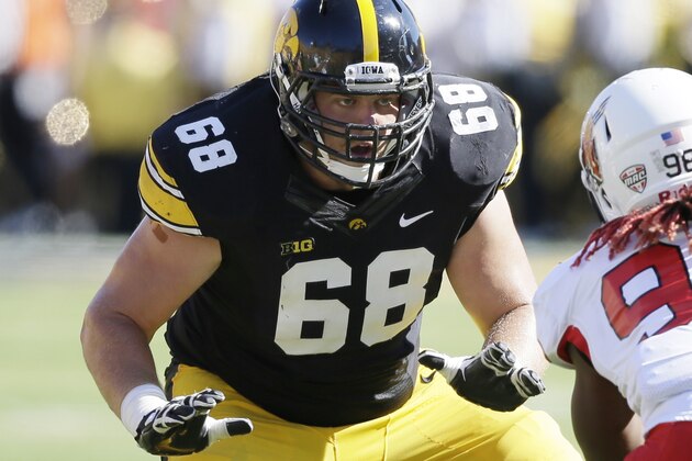Iowa offensive linesman Brandon Scherff (68) looks to make a block during the first half of an NCAA college football game against Ball State, Saturday, Sept. 6, 2014, in Iowa City, Iowa. (AP Photo/Charlie Neibergall)