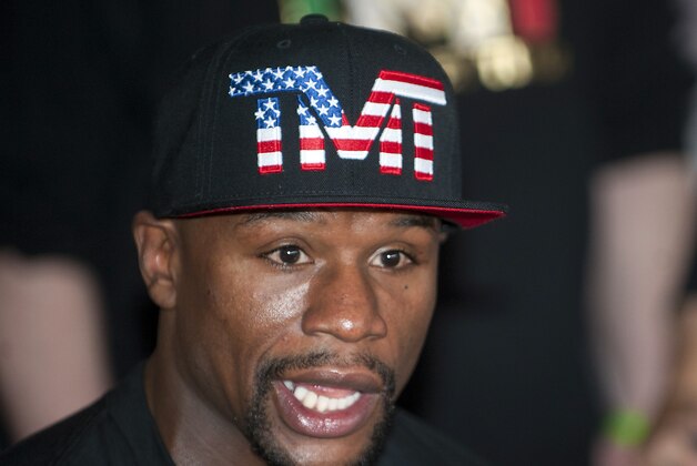 Apr 14, 2015; Las Vegas, NV, USA; Floyd Mayweather Jr., answers questions from reporters before training at Mayweather Boxing Club. Mandatory Credit: Stephen R. Sylvanie-USA TODAY Sports