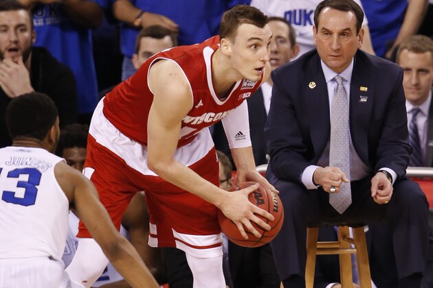 Apr 6, 2015; Indianapolis, IN, USA; (Editor's Note: Caption Correction) Wisconsin Badgers forward Sam Dekker (15) looks to pass as Duke Blue Devils head coach Mike Krzyzewski watches during the first half in the 2015 NCAA Men's Division I Championship game at Lucas Oil Stadium. Mandatory Credit: Brian Spurlock-USA TODAY Sports