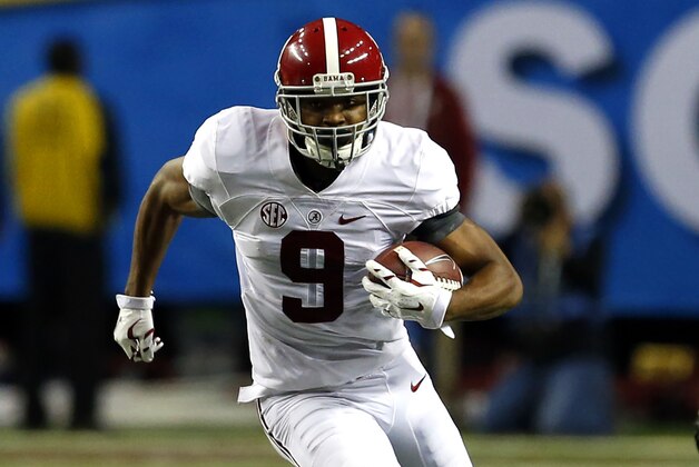 Alabama wide receiver Amari Cooper (9) carries the ball after a reception during the first half of an NCAA college football game against Missouri Saturday, Dec. 6, 2014, in Atlanta, Ga. (AP Photo/Butch Dill)