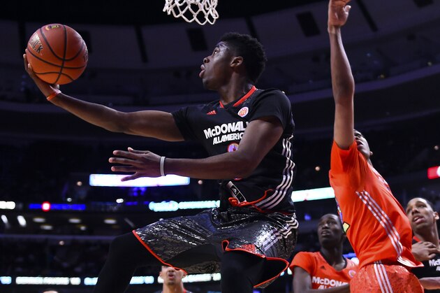 Apr 2, 2014; Chicago, IL, USA; McDonald's All American West guard Emmanuel Mudiay (0) shoots the ball against McDonald's All American East center Myles Turner (35) during the second half at the United Center. The West defeats the East 105-102. Mandatory Credit: Mike DiNovo-USA TODAY Sports