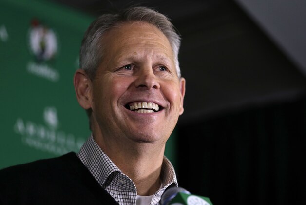 Danny Ainge, Boston Celtics president of basketball operations, smiles as he discusses  the trade of point guard Rajon Rondo prior to an NBA basketball game in Boston, Friday, Dec. 19, 2014. The Celtics traded Rondo to Dallas on Thursday night, Dec. 18, 2014, cutting ties with the last remnant of Boston's last NBA championship while giving Dirk Nowitzki and the Mavericks a chance at another title. (AP Photo/Charles Krupa)