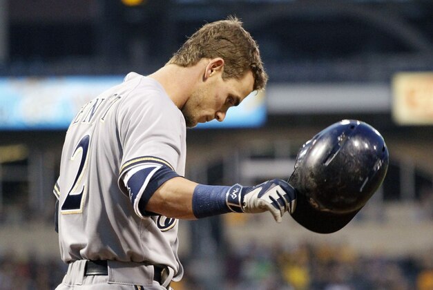 Apr 17, 2015; Pittsburgh, PA, USA; Milwaukee Brewers second baseman Scooter Gennett (2) tosses his helmet after striking out to end the fourth inning against the Pittsburgh Pirates at PNC Park. Mandatory Credit: Charles LeClaire-USA TODAY Sports