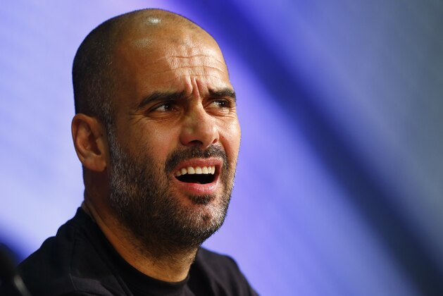 Bayern's head coach Pep Guardiola from Spain listens to questions of journalists during a news conference prior to the Champions League quarterfinal second leg soccer match between FC Bayern Munich and FC Porto at Allianz Arena in Munich, southern Germany, Monday, April 20, 2015. Munich will face Porto Tuesday. (AP Photo/Matthias Schrader)
