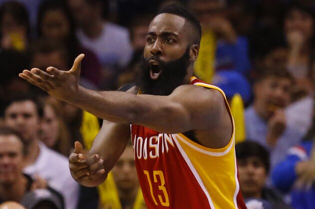 Houston Rockets guard James Harden (13) gestures to an official during an NBA basketball game between the Houston Rockets and the Oklahoma City Thunder in Oklahoma City, Sunday, April 5, 2015. Houston won 115-112. (AP Photo/Sue Ogrocki)