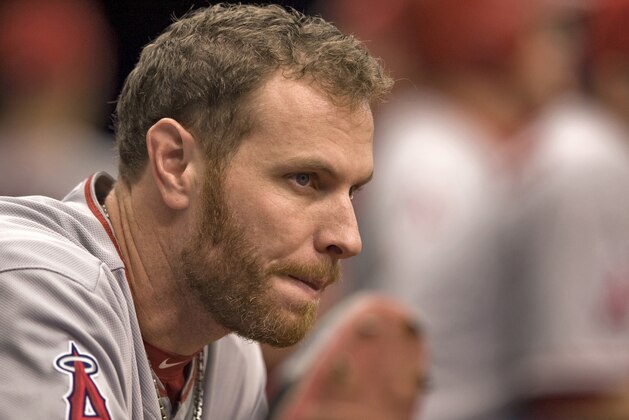 Los Angeles Angels' Josh Hamilton stretches in the dugout during a baseball game against the Tampa Bay Rays Sunday, Aug. 3, 2014, in St. Petersburg, Fla. (AP Photo/Steve Nesius)