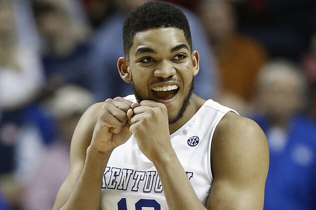 Kentucky forward Karl-Anthony Towns (12) celebrates a goal against the Florida during the second half of an NCAA college basketball game in the quarter final round of the Southeastern Conference tournament, Friday, March 13, 2015, in Nashville, Tenn. (AP Photo/Steve Helber)