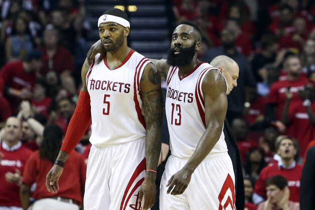 Apr 18, 2015; Houston, TX, USA; Houston Rockets forward Josh Smith (5) and guard James Harden (13) walk off the court after the end of the first quarter against the Dallas Mavericks in game one of the first round of the NBA Playoffs at Toyota Center. Mandatory Credit: Troy Taormina-USA TODAY Sports