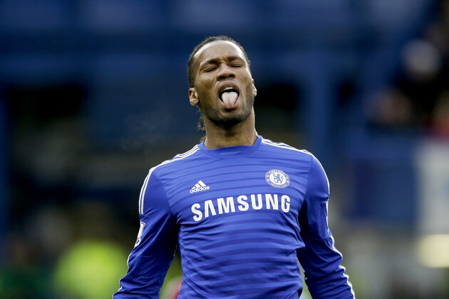 Chelsea's Didier Drogba sticks out his tongue as he reacts after failing to score during the English Premier League soccer match between Chelsea and West Ham at Stamford Bridge stadium in London, Friday, Dec. 26, 2014.  (AP Photo/Matt Dunham)