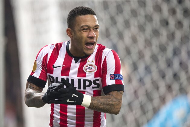 PSV’s Memphis Depay reacts after missing an opportunity to score during the first leg of the round of 32 Europa League match between PSV Eindhoven and Zenith Saint Petersburg, at Philips stadium, in Eindhoven, Netherlands, Thursday Feb. 19, 2015. (AP Photo/Ermindo Armino)