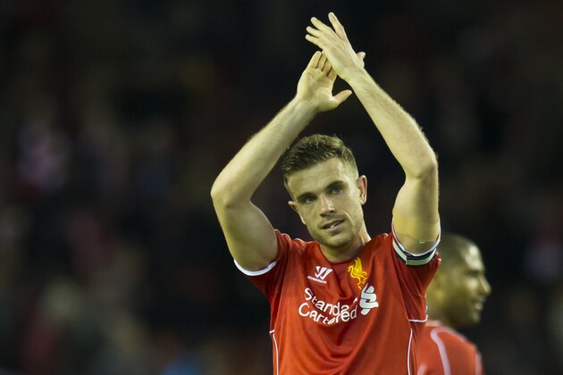 Liverpool's Jordan Henderson applauds supporters after his team's 2-0 win during the English Premier League soccer match between Liverpool and Newcastle at Anfield Stadium, Liverpool, England, Monday, April 13, 2015. (AP Photo/Jon Super)