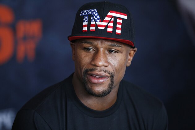 Floyd Mayweather Jr. speaks with reporters before a workout Tuesday, April 14, 2015, in Las Vegas. Mayweather is scheduled to face Manny Pacquiao in a welterweight boxing match in Las Vegas on May 2. (AP Photo/John Locher)