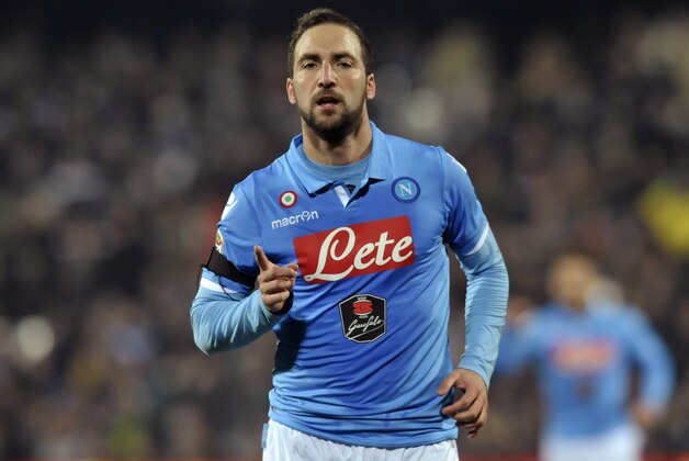 Napoli's Gonzalo Higuain celebrates after scoring during the Serie A soccer match against Cesena, at Cesena's Manuzzi stadium, Italy, Tuesday, Jan 6, 2015.(AP Photo/Marco Vasini)