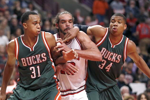 Milwaukee Bucks center John Henson, left, and forward Giannis Antetokounmpo, right, block out Chicago Bulls center Joakim Noah, center, during the second half in Game 2 of the NBA basketball playoffs Monday, April 20, 2015, in Chicago. The Bulls won 91-82. (AP Photo/Charles Rex Arbogast)