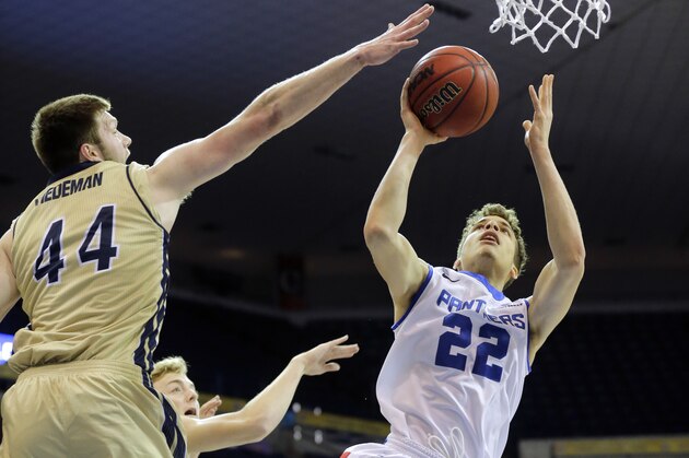 Georgia State guard R.J. Hunter (22) shoots around Georgia Southern forward Trent Wiedeman (44) in the first half of an NCAA college basketball game in the championship of the Sunbelt Conference tournament in New Orleans, Sunday, March 15, 2015. (AP Photo/Bill Haber)