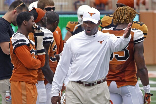 Texas coach Charlie Strong gestures during the first quarter of the NCAA college football team's Orange and White spring game, Saturday, April 18, 2015, in Austin, Texas. (AP Photo/Michael Thomas)