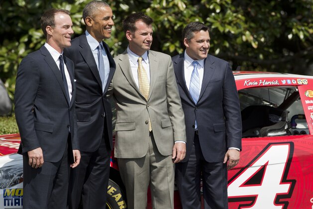 President Barack Obama welcomes, from left, NASCAR 2104 Sprint Cup Series champion Kevin Harvick, Harvick's Stewart Haas Racing crew chief Rodney Childers, and team owner Tony Stewart, during a ceremony on the South Lawn of the White House in Washington, Tuesday, April 21, 2015. (AP Photo/Pablo Martinez Monsivais)