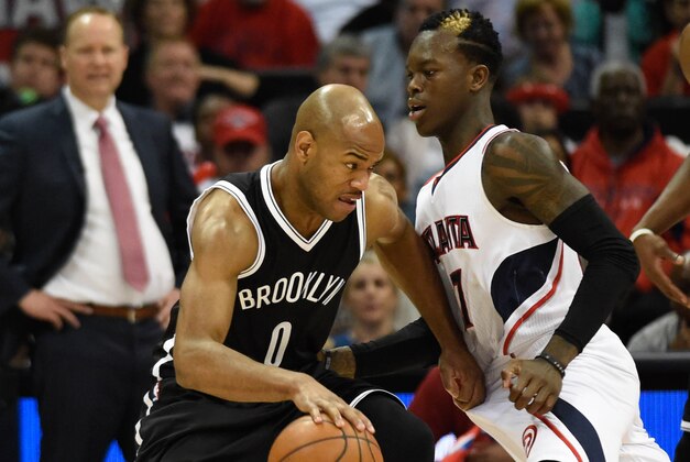 Apr 19, 2015; Atlanta, GA, USA; Brooklyn Nets guard Jarrett Jack (0) works against Atlanta Hawks guard Dennis Schroder (17) during the second half in game one of the first round of the NBA Playoffs at Philips Arena. The Hawks defeated the Nets 99-92. Mandatory Credit: Dale Zanine-USA TODAY Sports