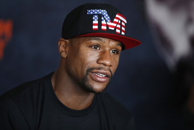 Boxer Floyd Mayweather Jr. speaks with the media before a workout Tuesday, April 14, 2015, in Las Vegas. Mayweather will face Manny Pacquiao in a welterweight boxing match in Las Vegas on May 2. (AP Photo/John Locher)