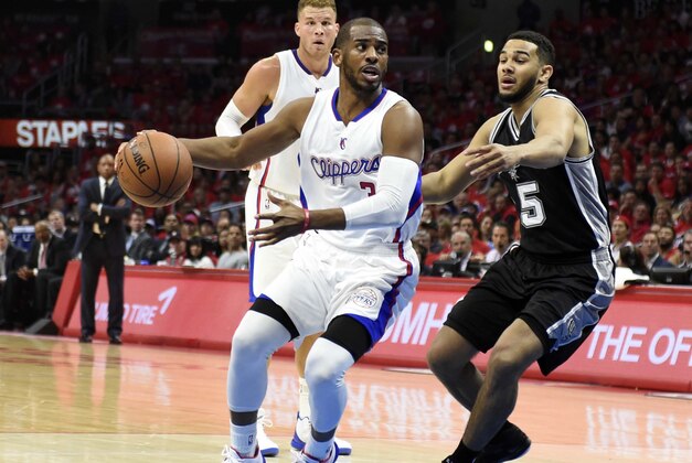 Apr 19, 2015; Los Angeles, CA, USA; Los Angeles Clippers guard Chris Paul (3) drives to the basket against San Antonio Spurs guard Cory Joseph (5) during the first quarter in game one of the first round of the NBA Playoffs at Staples Center. Mandatory Credit: Richard Mackson-USA TODAY Sports