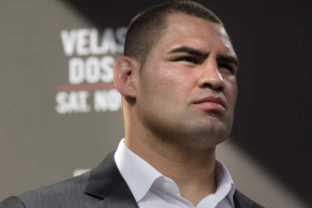 FILE - This Nov. 9, 2011 file photo shows Cain Velasquez listening during a news conference in Los Angeles. Velasquez has the looks of a bouncer and the voice of an elementary-school teacher, his likely profession if his MMA career hadn't skyrocketed out of Arizona State. The UFC's menacing heavyweight champion is the star of its first prime-time network show this weekend, and Fox is eager to put Velasquez's inspiring life story in front of a huge audience  (AP Photo/Jae C. Hong, File)