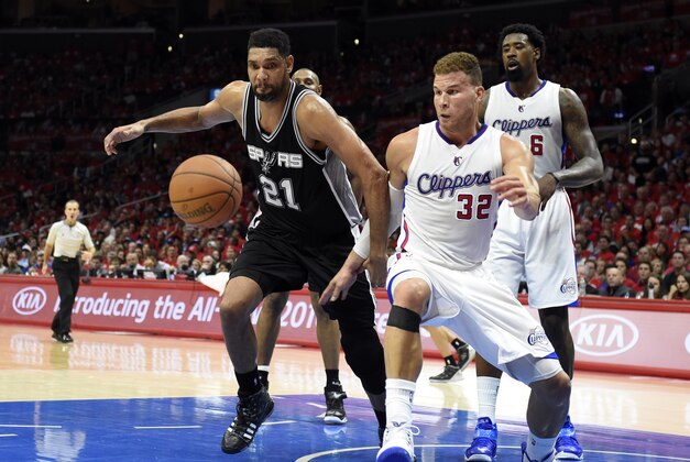 Apr 19, 2015; Los Angeles, CA, USA; San Antonio Spurs forward Tim Duncan (21) and Los Angeles Clippers forward Blake Griffin (32) go for a loose ball during the fourth quarter in game one of the first round of the NBA Playoffs at Staples Center. Mandatory Credit: Richard Mackson-USA TODAY Sports