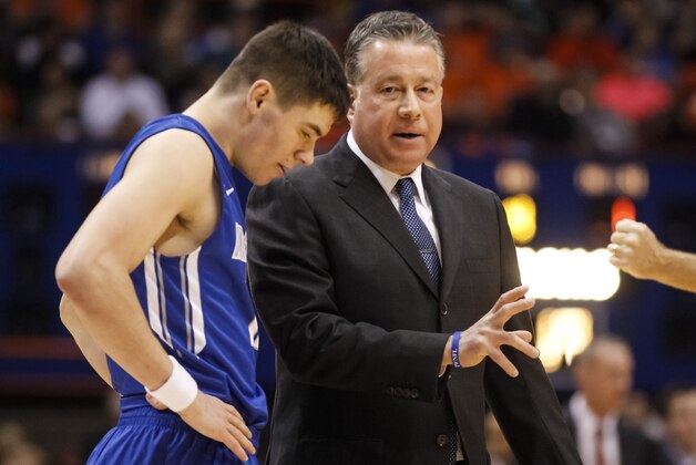 Air Force head coach Dave Pilipovich talks to Matt Mooney during the second half of an NCAA college basketball game in Boise, Idaho, on Wednesday, Feb. 11, 2015. Boise State won 67-42. (AP Photo/Otto Kitsinger)