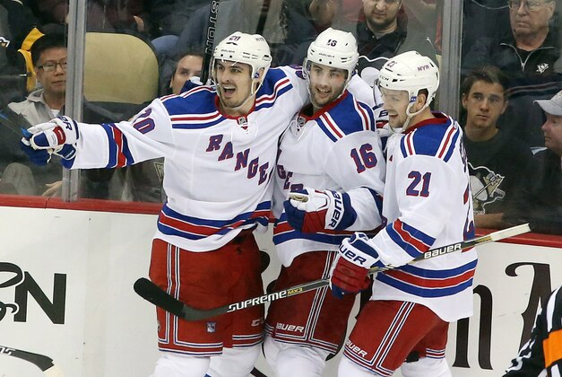 Apr 20, 2015; Pittsburgh, PA, USA; New York Rangers left wing Chris Kreider (20) celebrates scoring a goal with center Derick Brassard (16) and center Derek Stepan (21) against the Pittsburgh Penguins during the second period in game three of the first round of the 2015 Stanley Cup Playoffs at the CONSOL Energy Center. Mandatory Credit: Charles LeClaire-USA TODAY Sports