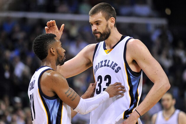 Memphis Grizzlies guard Mike Conley (11) and center Marc Gasol (33) talk between plays in the second half of an NBA basketball game Friday, April 3, 2015, in Memphis, Tenn. The Grizzlies won 100-92. (AP Photo/Brandon Dill)
